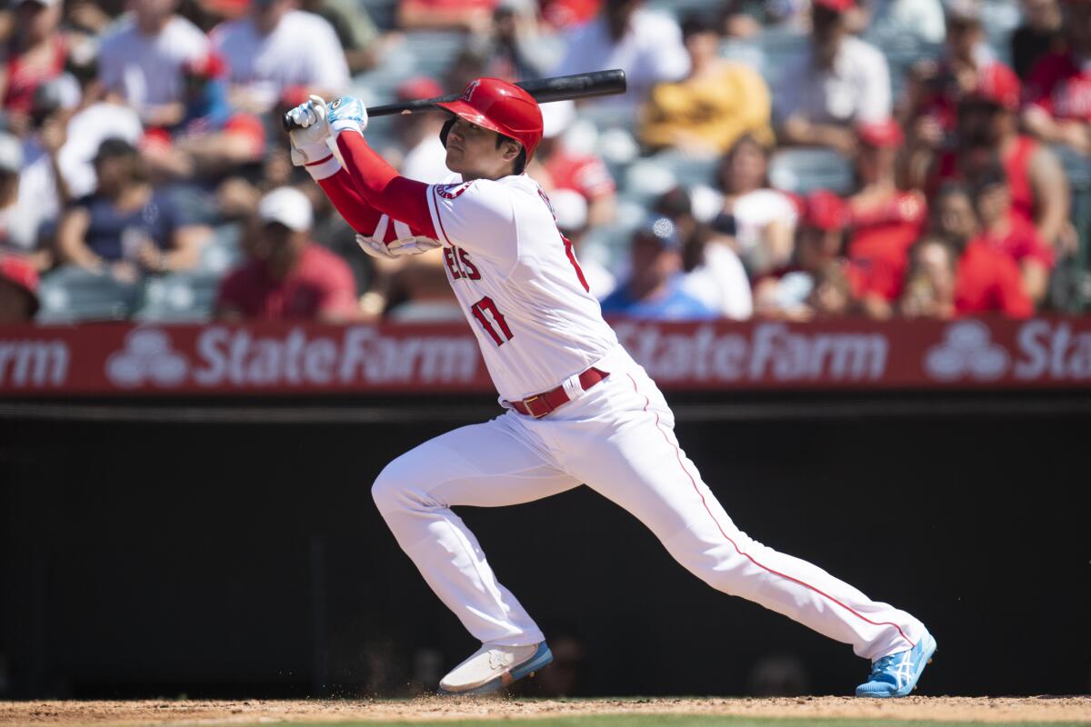 Angels designated hitter Shohei Ohtani hits a two-run home run during the fifth inning.