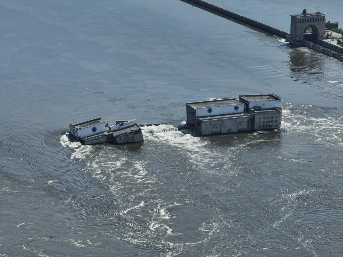 Water flowing over collapsed dam in Ukraine