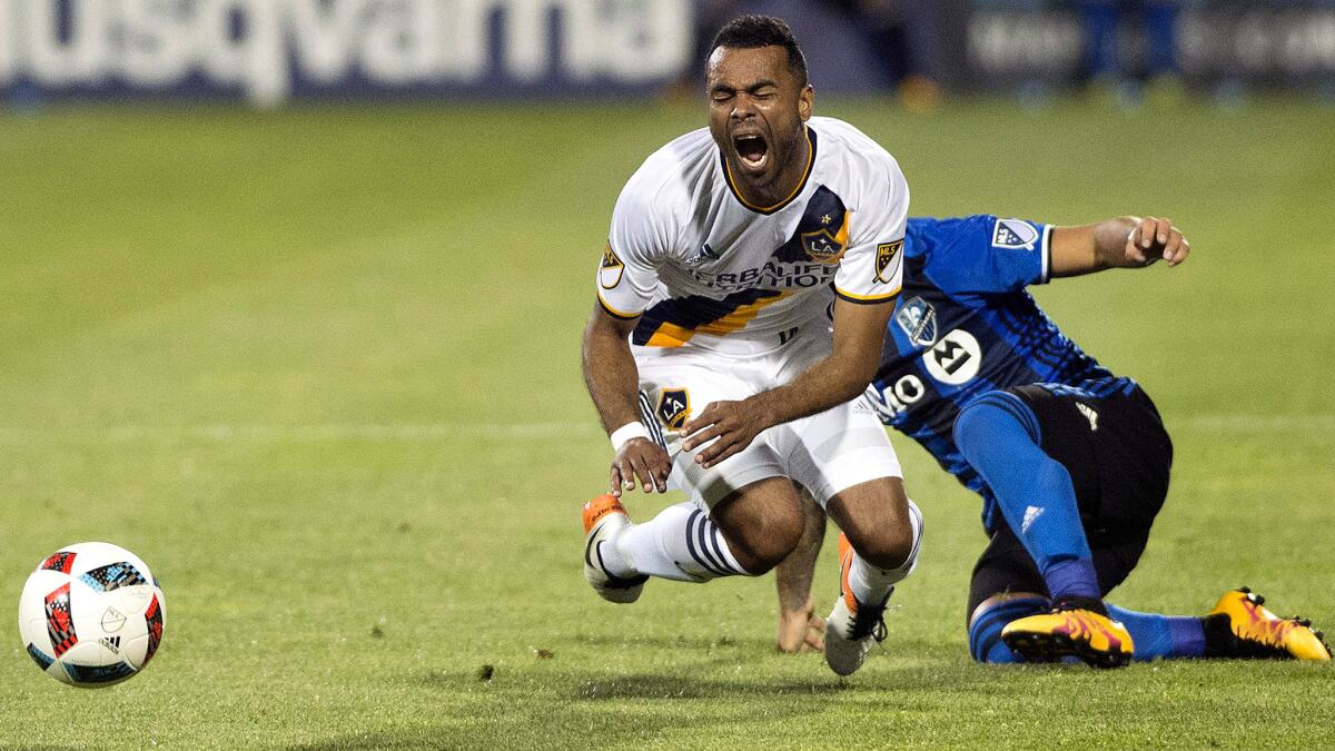 Galaxy defender Ashley Cole is tackled by Montreal's Lucas Ontivero during the second half Saturday.