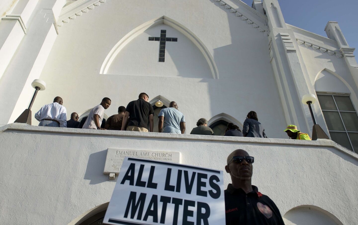 People arrive for services at the Emanuel AME Church on Sunday in Charleston, S.C.