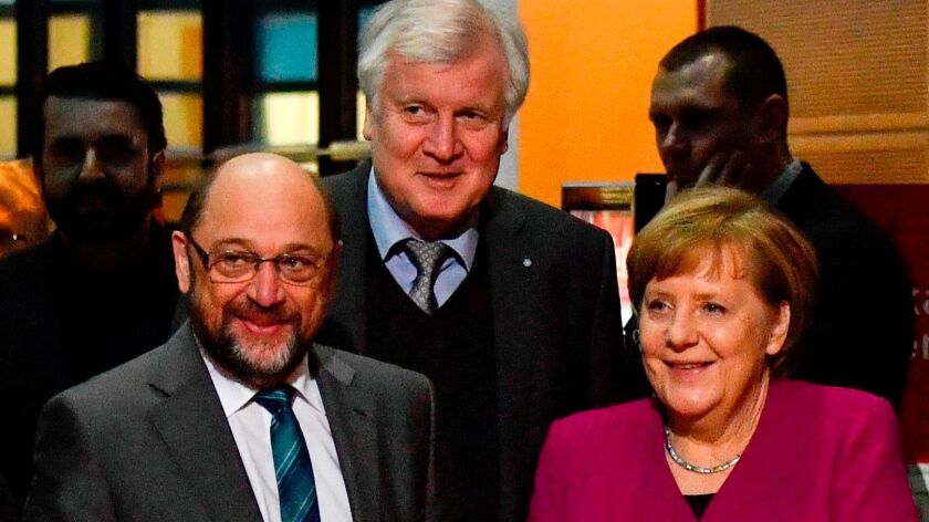 German Chancellor Angela Merkel with Martin Schulz, left, of the Social Democrats and Horst Seehofer, chairman of the Bavarian Christian Social Union.