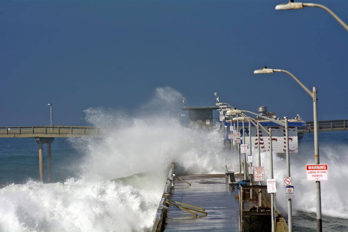 Battered Ocean Beach pier will remain closed through winter storm season -  The San Diego Union-Tribune