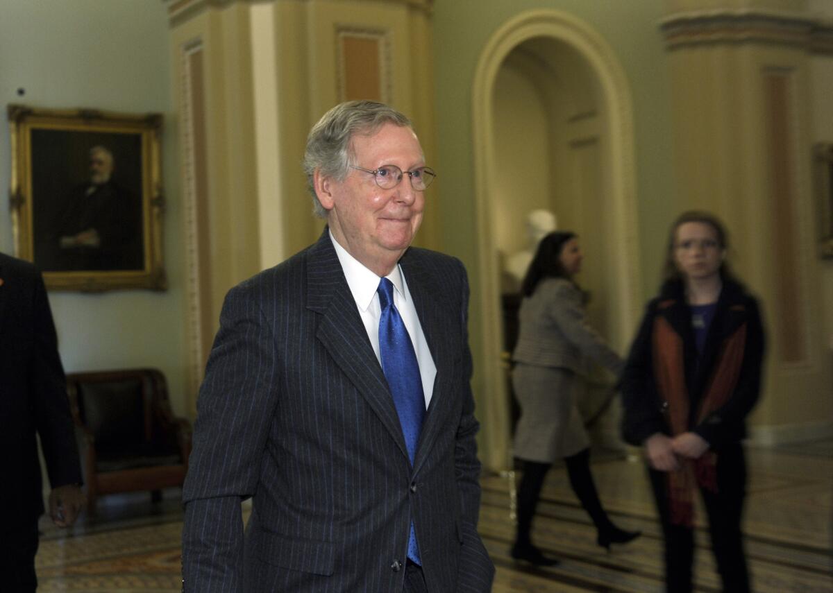 Senate Minority Leader Mitch McConnell (R-Ky.) walks to his office after speaking from the chamber floor.