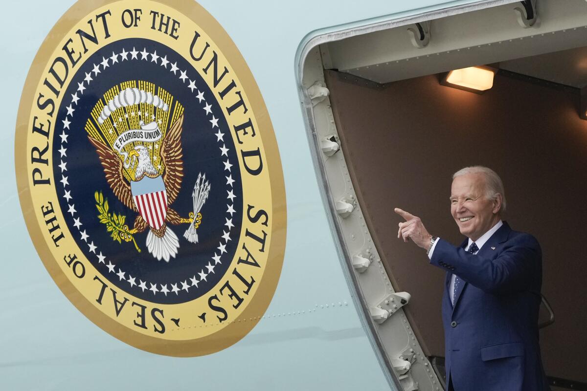 President Biden gestures from Air Force One