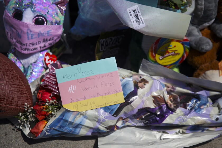 LAPD overlooked 3 dead children in home for 7 hours 4 Heartfelt notes, flowers, candles and a football left by residents at a memorial.