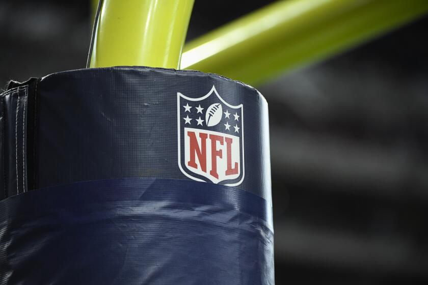 The NFL logo is seen on the goal post during the first half of an NFL football game between the Houston Texans and the Tennessee Titans Sunday, Jan. 9, 2022, in Houston. (AP Photo/Justin Rex)