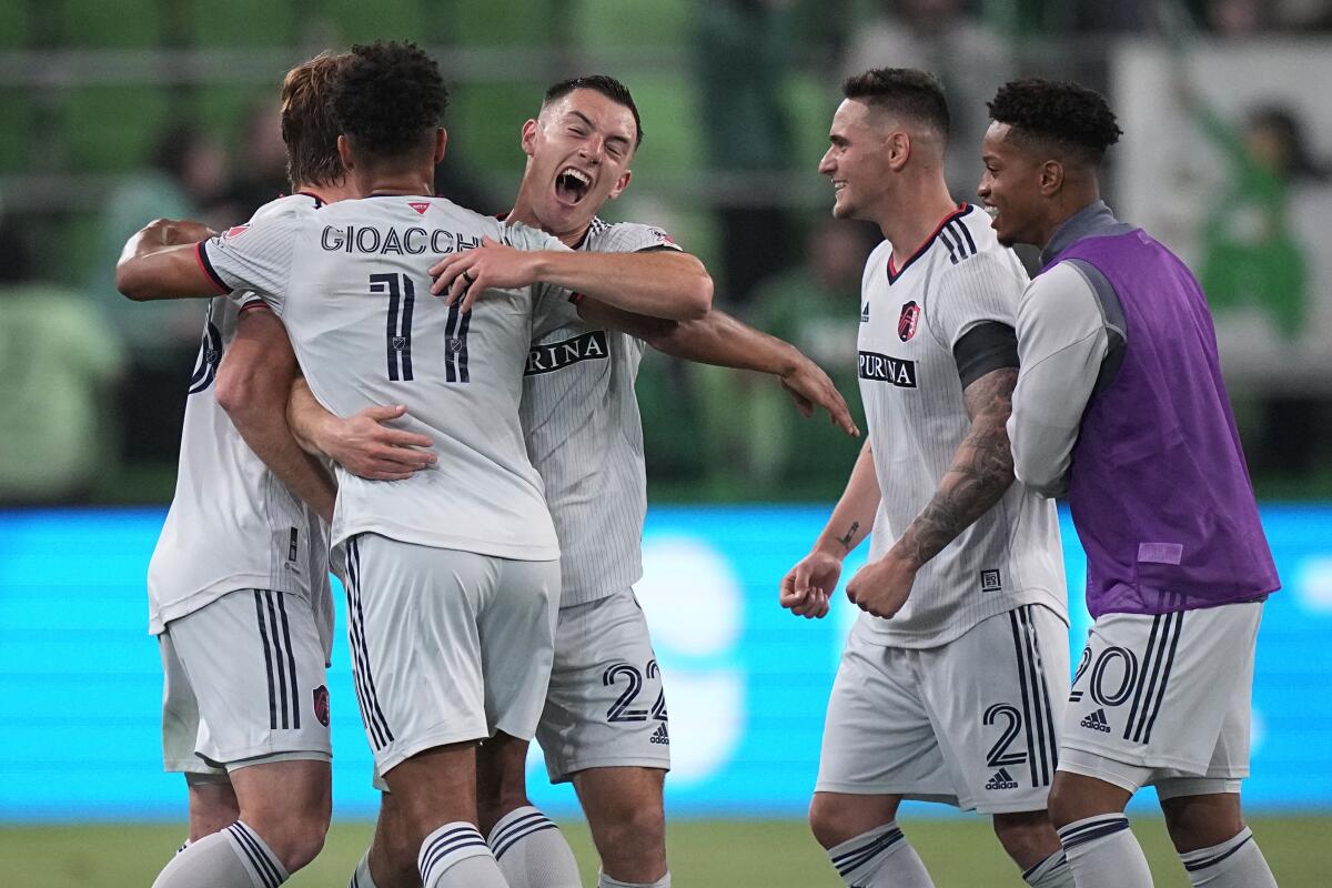 St Louis City SC defender Kyle Heibert hugs Nicholas Gioacchini as they celebrate their win over Austin FC