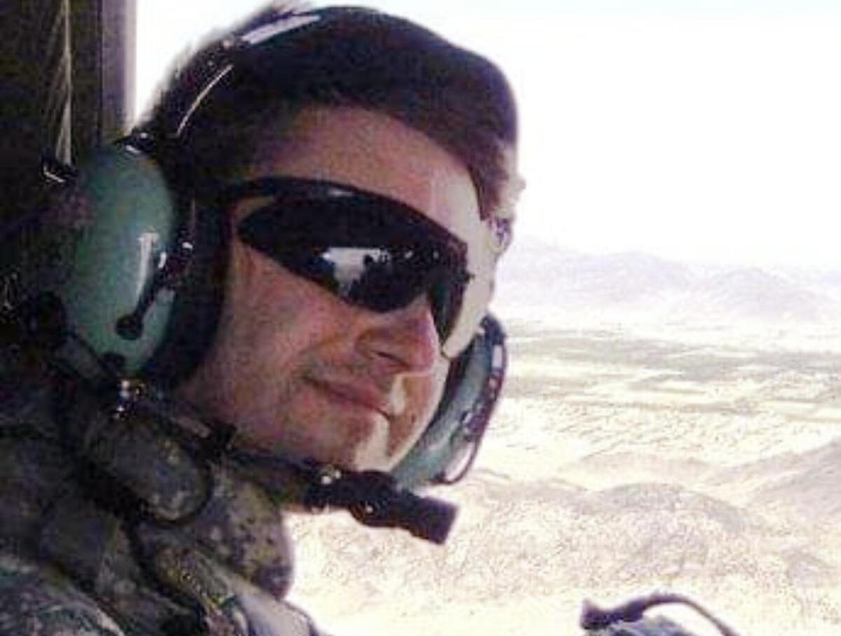 Thomas Coffman flies in a helicopter over Kandahar in 2011.