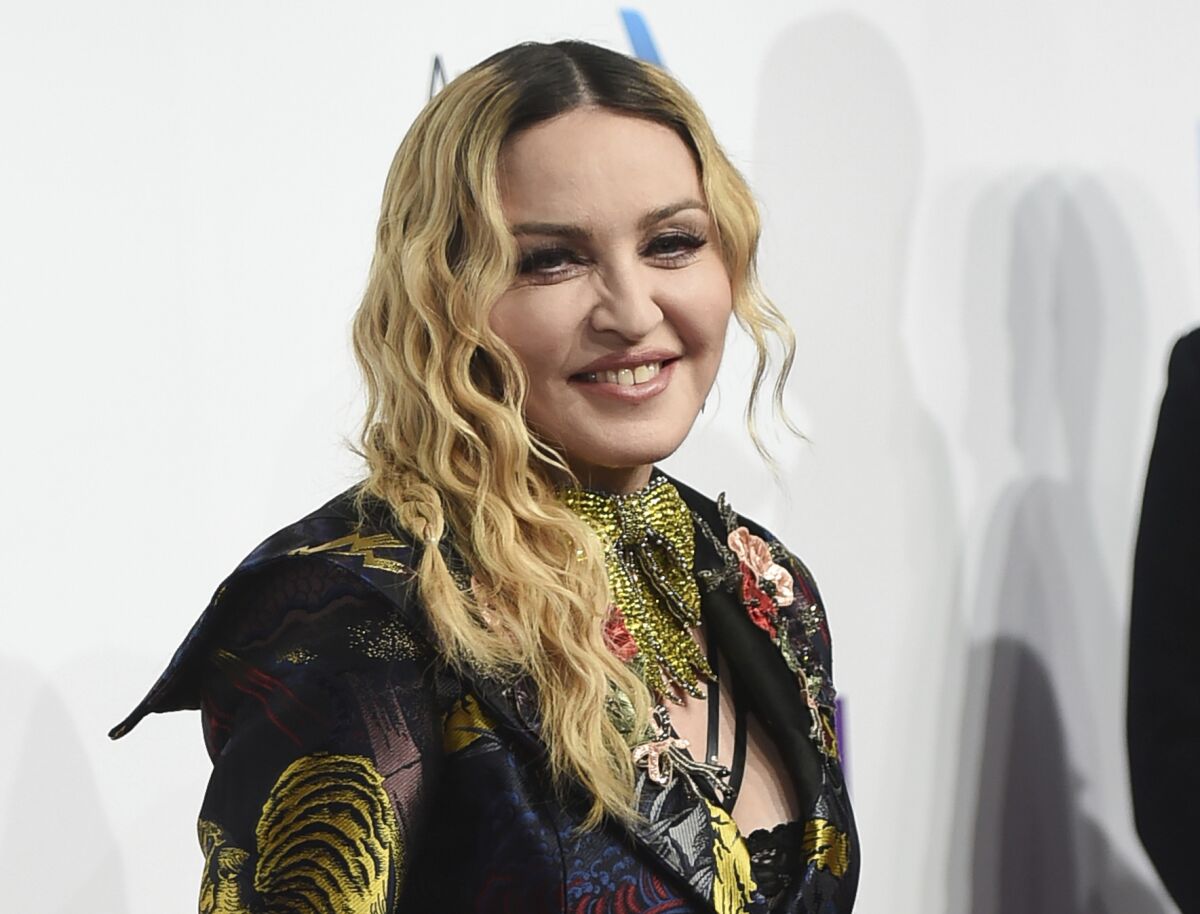FILE - In this Dec. 9, 2016 file photo, Madonna attends the 11th Annual Billboard Women in Music honors in New York. Madonna will direct a biopic about herself for Universal Pictures. Madonna will direct and co-write with “Juno” screenwriter Diablo Cody. (Photo by Evan Agostini/Invision/AP, File)