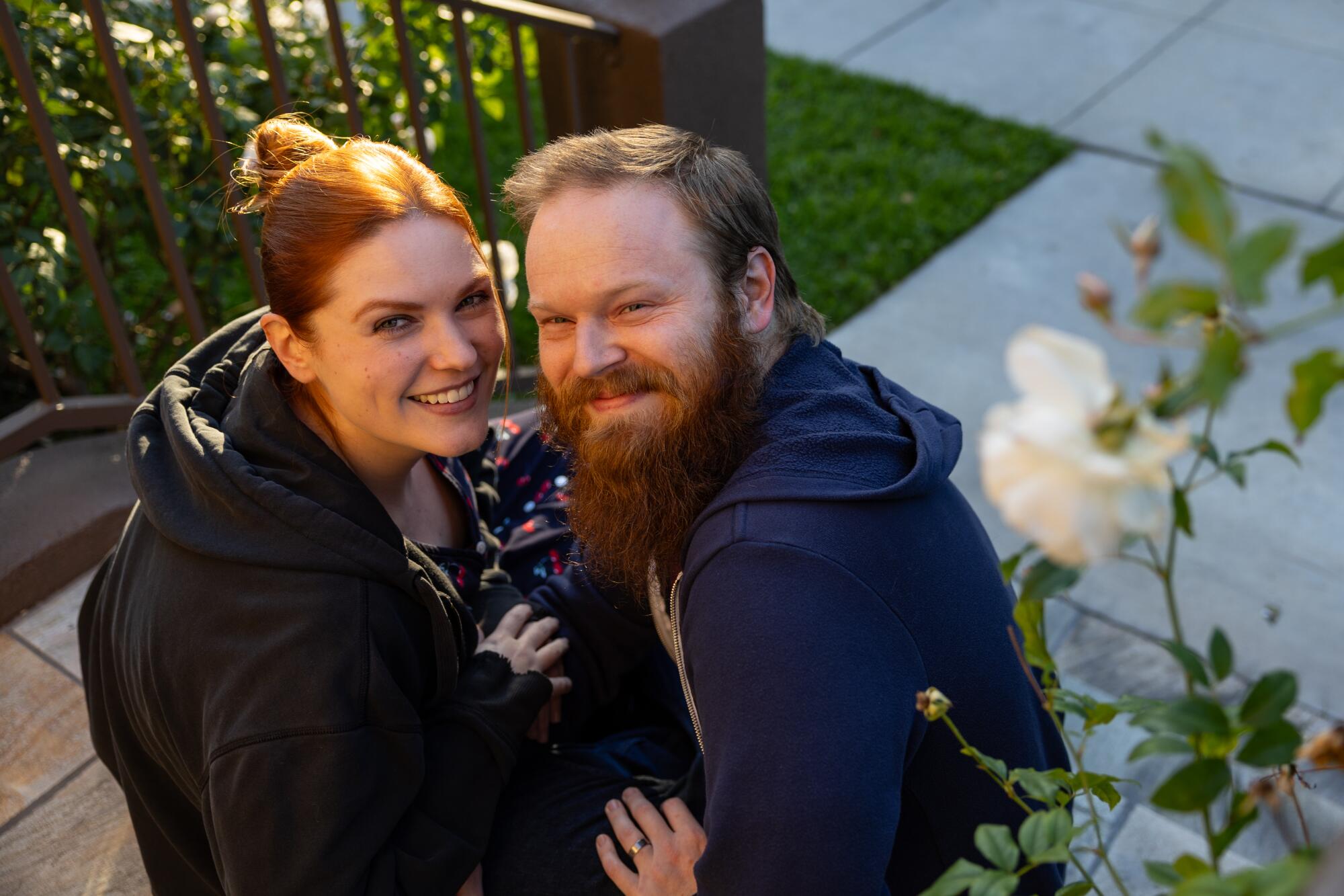 A man and a woman sit together.