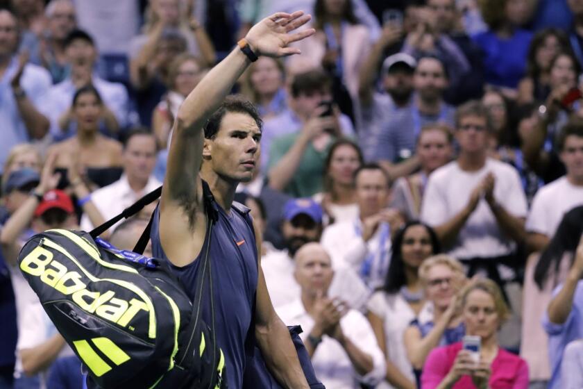 Rafael Nadal, of Spain, waves to fans after retiring from a match against Juan Martin del Potro, of Argentina, during the semifinals of the U.S. Open tennis tournament, Friday, Sept. 7, 2018, in New York. (AP Photo/Seth Wenig)