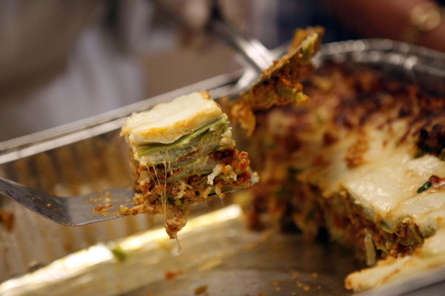 Lasagna verde with meat ragu and spinach, served by Gino Elizabeth Angelini.