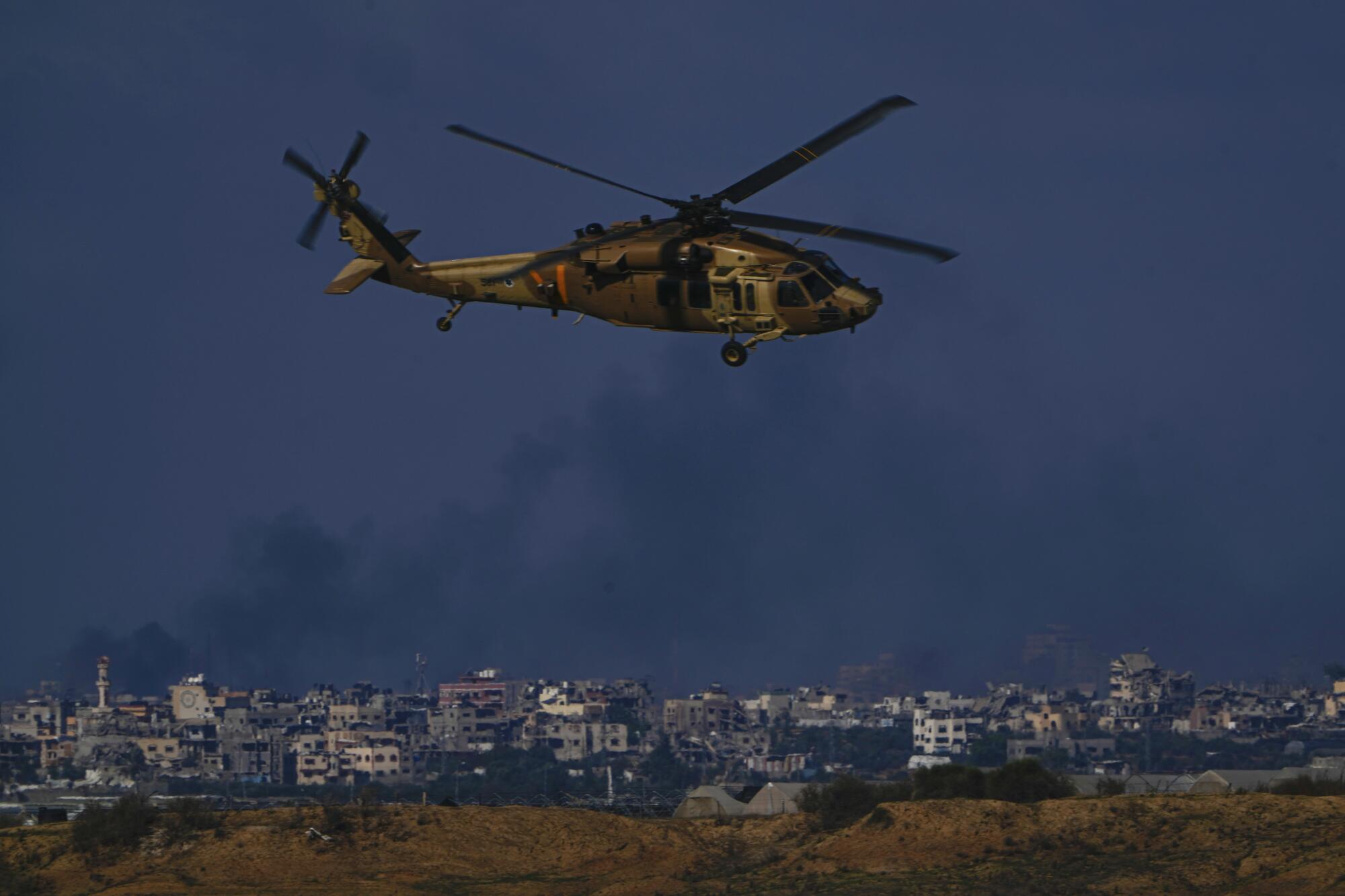 Israeli military helicopter flying near Israeli-Gaza border