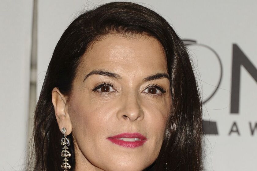 FILE - In this June 12, 2011 file photo, Annabella Sciorra arrives at the 65th annual Tony Awards, in New York. Sciorra is alleging she was raped by Harvey Weinstein after he barged his way into her apartment in the 1990s. Sciorra and Daryl Hannah are the latest in dozens of women who have spoken out against Weinstein. Allegations range from unwanted advances to rape. He has been ousted from his own company and expelled from the motion picture academy. A Weinstein spokeswoman did not immediately respond to a request for comment. (AP Photo/Charles Sykes, File)