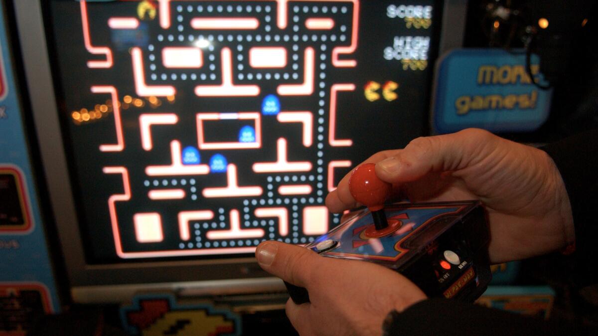 A gamer plays Ms. Pac-Man at a New York toy fair in 2005.