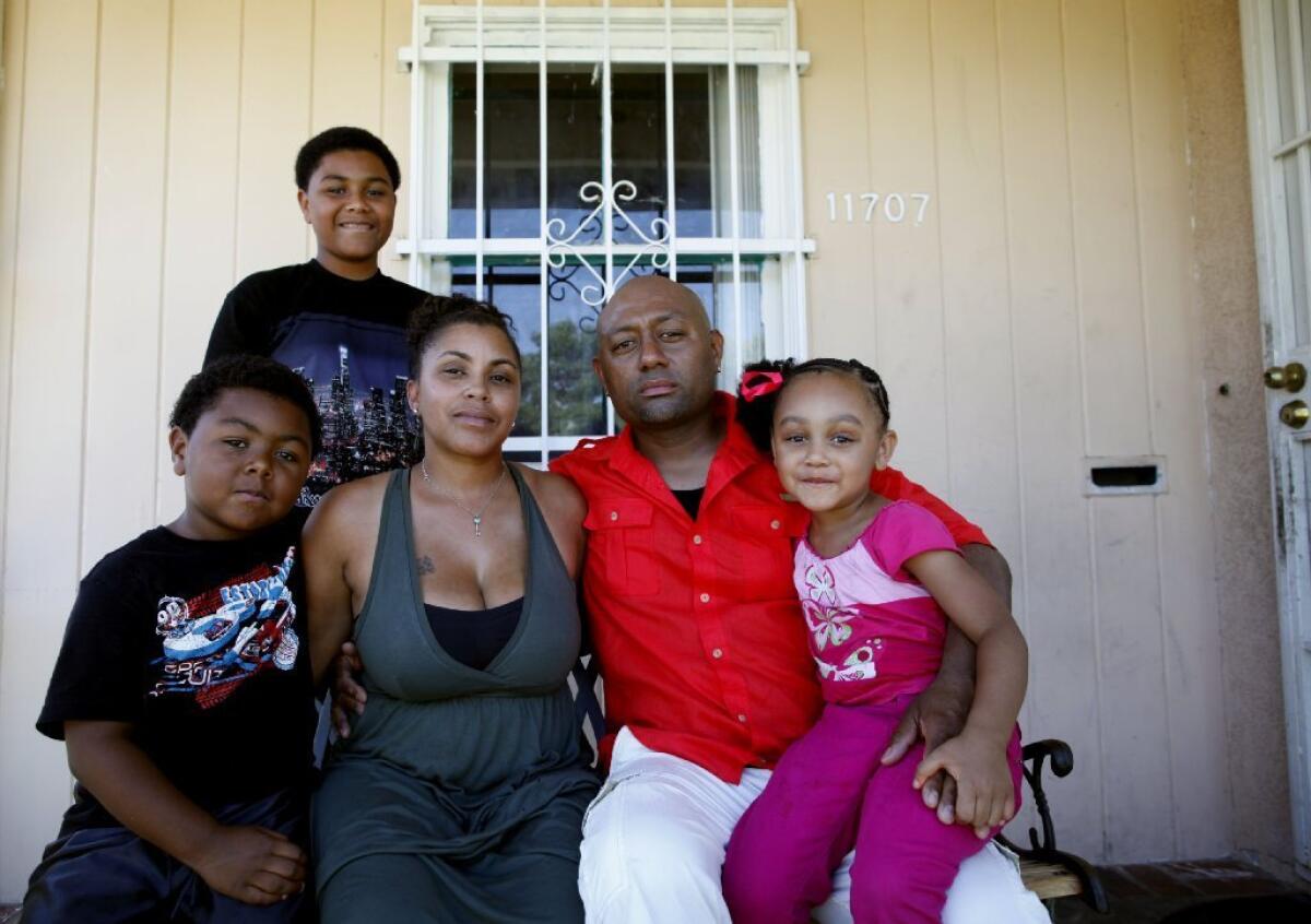 California has picked an auditor to review mortgage servicing by Ocwen Financial. Above, Tyesha Hansborough and husband Christley Paton, with children Chyler, Christley Jr. and Meelah, said they lost insurance on their home in Inglewood because of an Ocwen mixup.