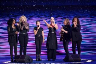 CHICAGO, IL AUGUST 22, 2024 - Pink, second right, and her daughter Willow Sage Hart, third left, perform during the Democratic National Convention Thursday, Aug. 22, 2024, in Chicago, IL. (Myung J. Chun/Los Angeles Times)