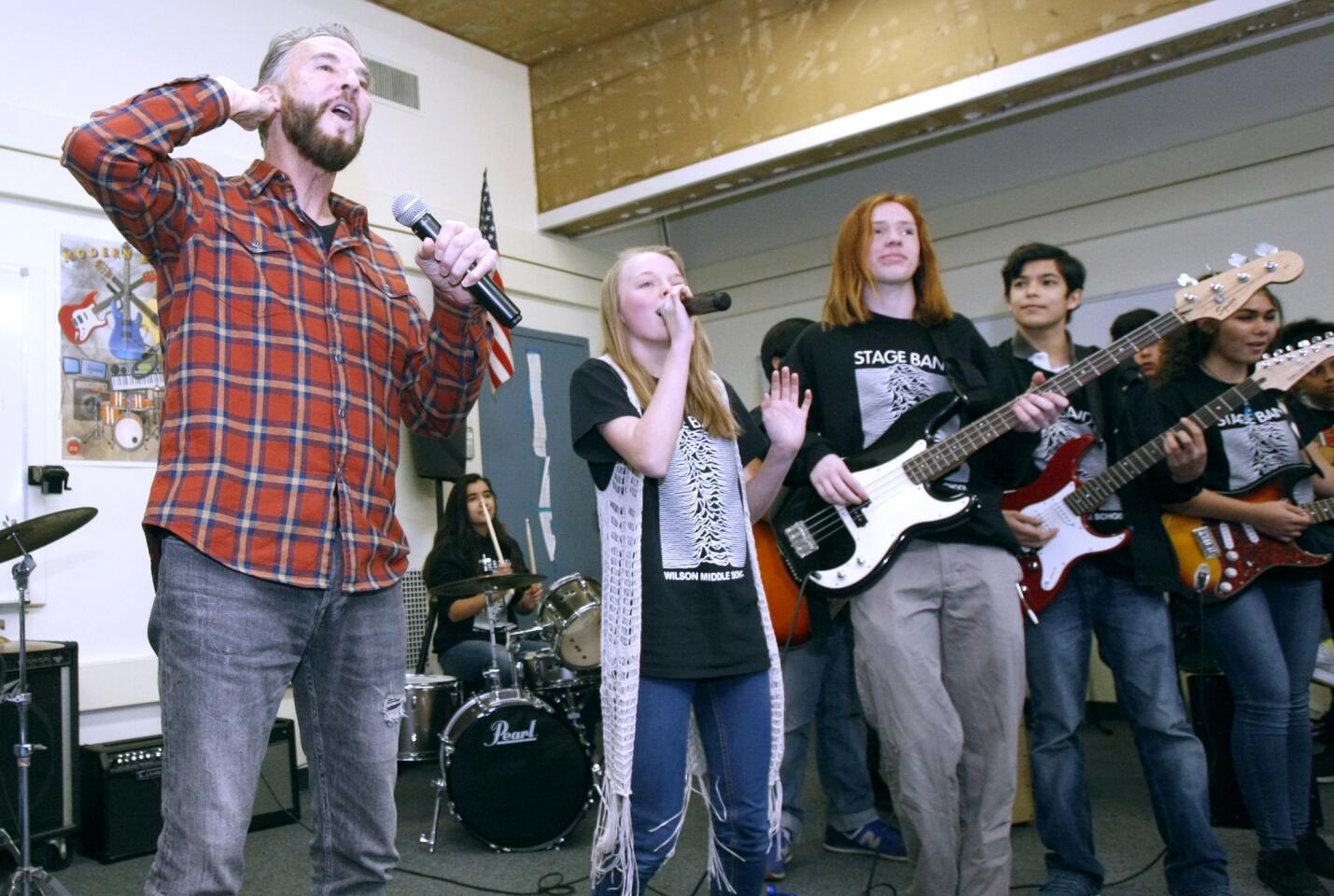 Wilson Middle School Stage Class students sing and play Footloose with Kenny Loggins during a special visit by the iconic American singer and songwriter to the Glendale school in Thursday, Jan. 26, 2017. Loggins gave the class tips about the music world and unveiled brand new instruments donated to the school after he helped raise $1.1 million at national nonprofit Little Kids Rock's benefit in New York City recently.