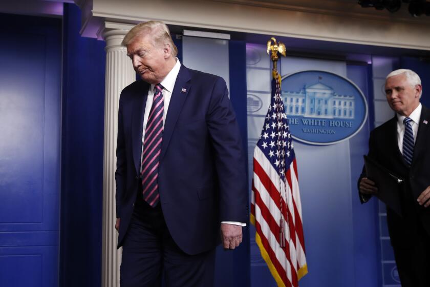 President Donald Trump and Vice President Mike Pence leave at the end of a briefing about the coronavirus in the James Brady Press Briefing Room of the White House, Friday, April 24, 2020, in Washington. (AP Photo/Alex Brandon)