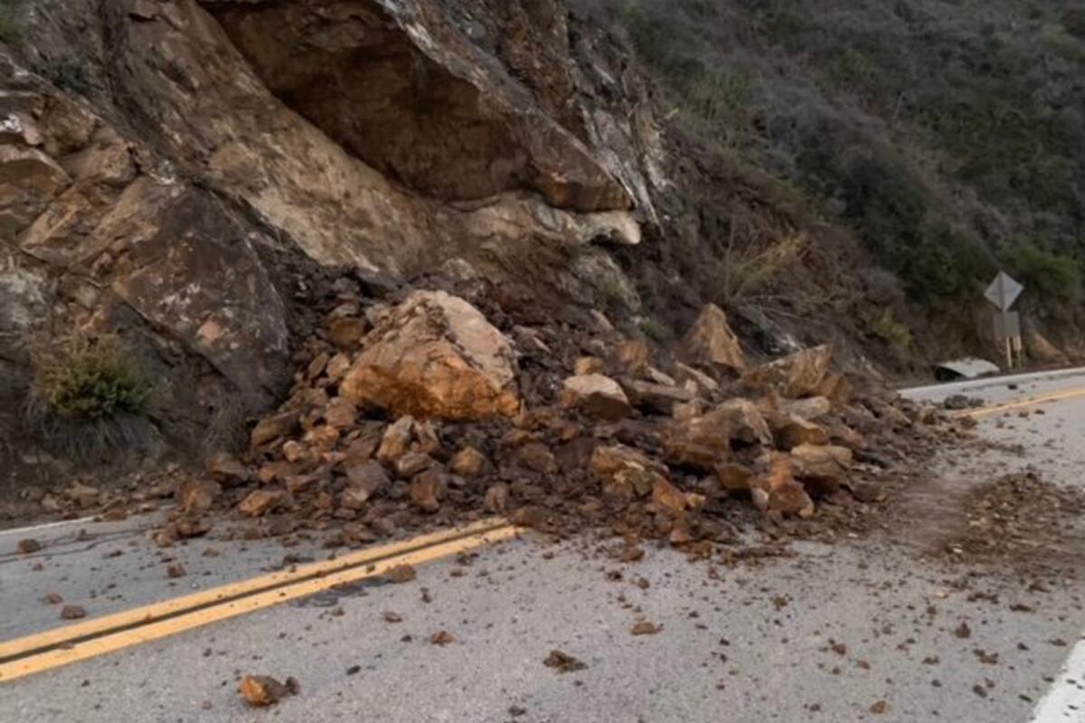 A rockslide covers a stretch of Highway 1 near Big Sur.