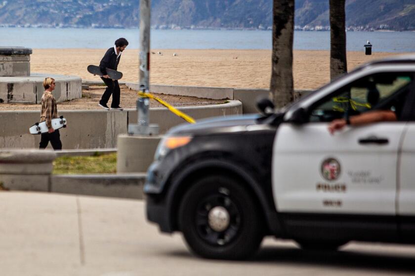 VENICE BEACH, CA - APRIL 06: LAPD clears people from using the skate park at Venice Beach during the coronavirus pandemic on Monday, April 6, 2020 in Venice Beach, CA. (Jason Armond / Los Angeles Times)