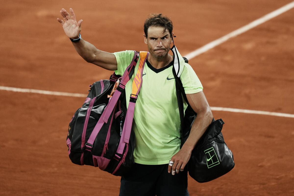 Rafael Nadal waves to the crowd after losing to Serbia's Novak Djokovic in their semifinal match of the French Open