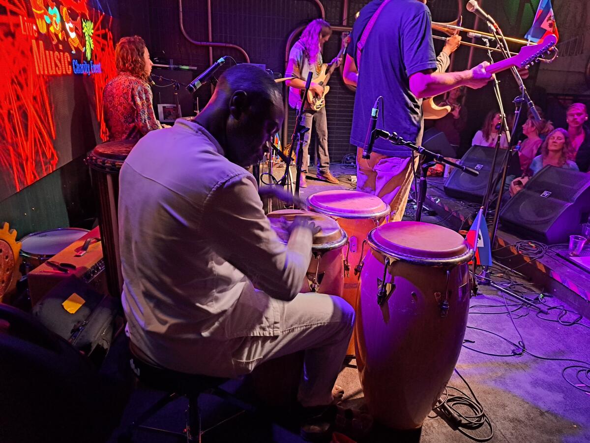 Kofi Andoh plays at the benefit concert for Haiti that he organized in Ocean Beach.