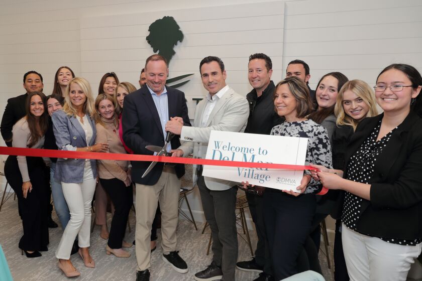 Sean and Jason Barry cut the ribbon to their new office space