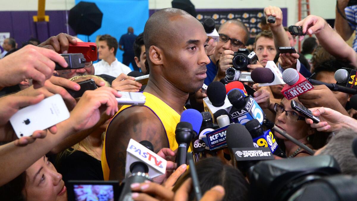 Lakers star Kobe Bryant answers questions from reporters during the team's media day in El Segundo on Sept. 29.