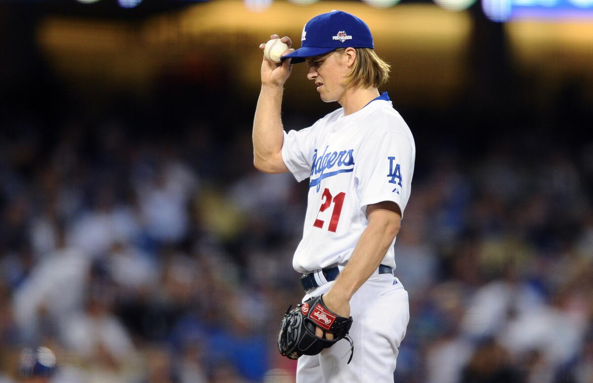 Dodgers pitcher Zack Greinke reacts after giving up a solo home run to Mets' Yeonis Cespedes in the second inning of Game 2 of the NLDS on Saturday.