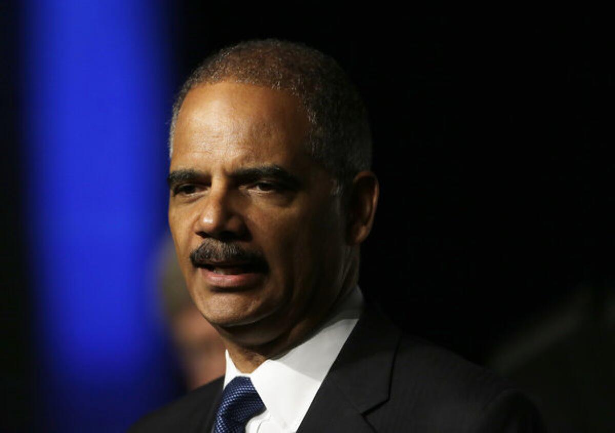 Atty. Gen. Eric Holder plans to challenge a new voter ID law in Texas, saying it is discriminatory.