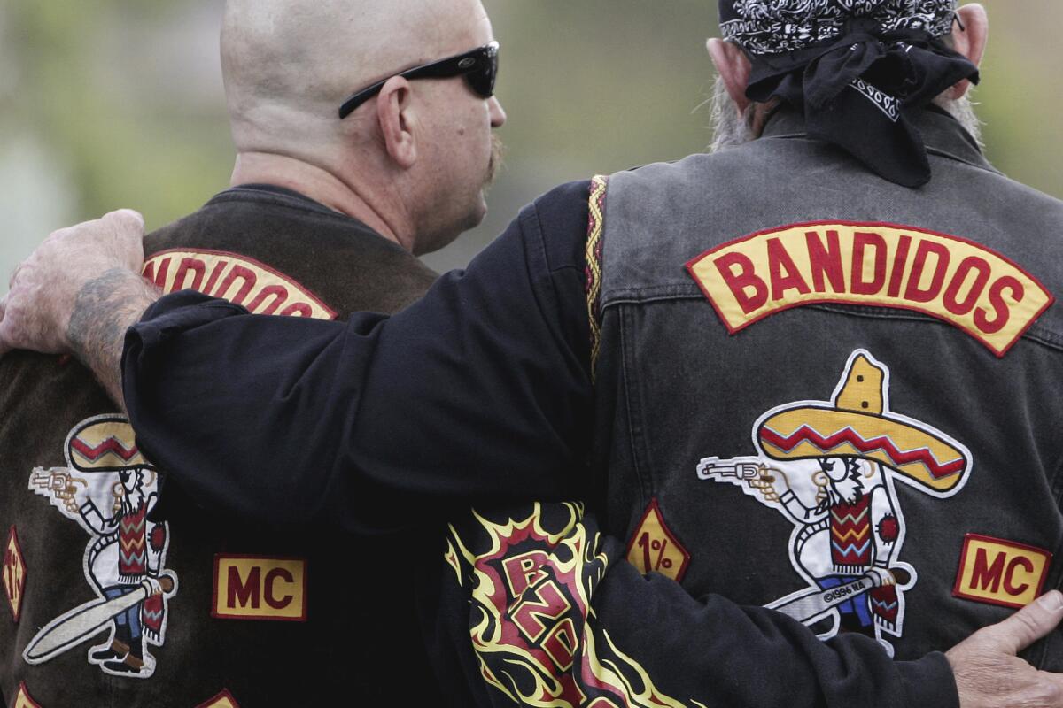 Members of the Bandidos wait in front of the court in Muenster, western Germany.