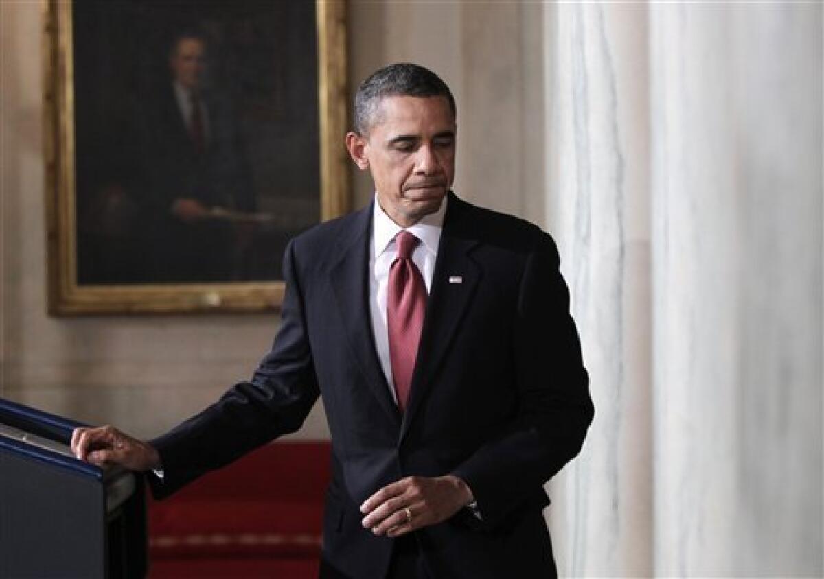 President Barack Obama walks away from the podium after speaking about the situation in Egypt in the Grand Foyer of the White House in Washington, Tuesday, Feb. 1, 2011. (AP Photo/Pablo Martinez Monsivais)
