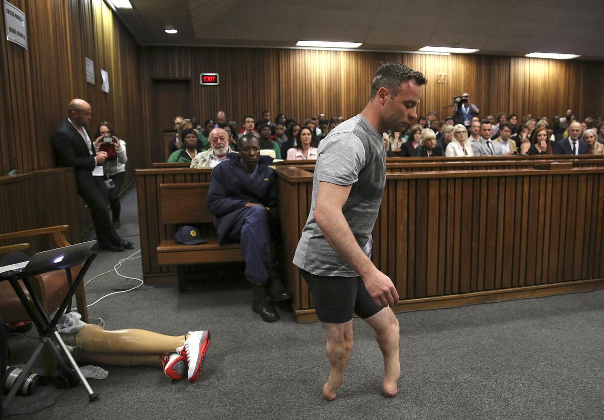 Oscar Pistorius' prosthetics lay on the floor as he walks on his stumps in the High Court in Pretoria, South Africa, on June 15.