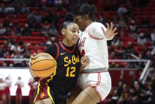 SALT LAKE CITY, UT - JANUARY 19 : JuJu Watkins #12 of the USC Trojans drives into Dasia Young.