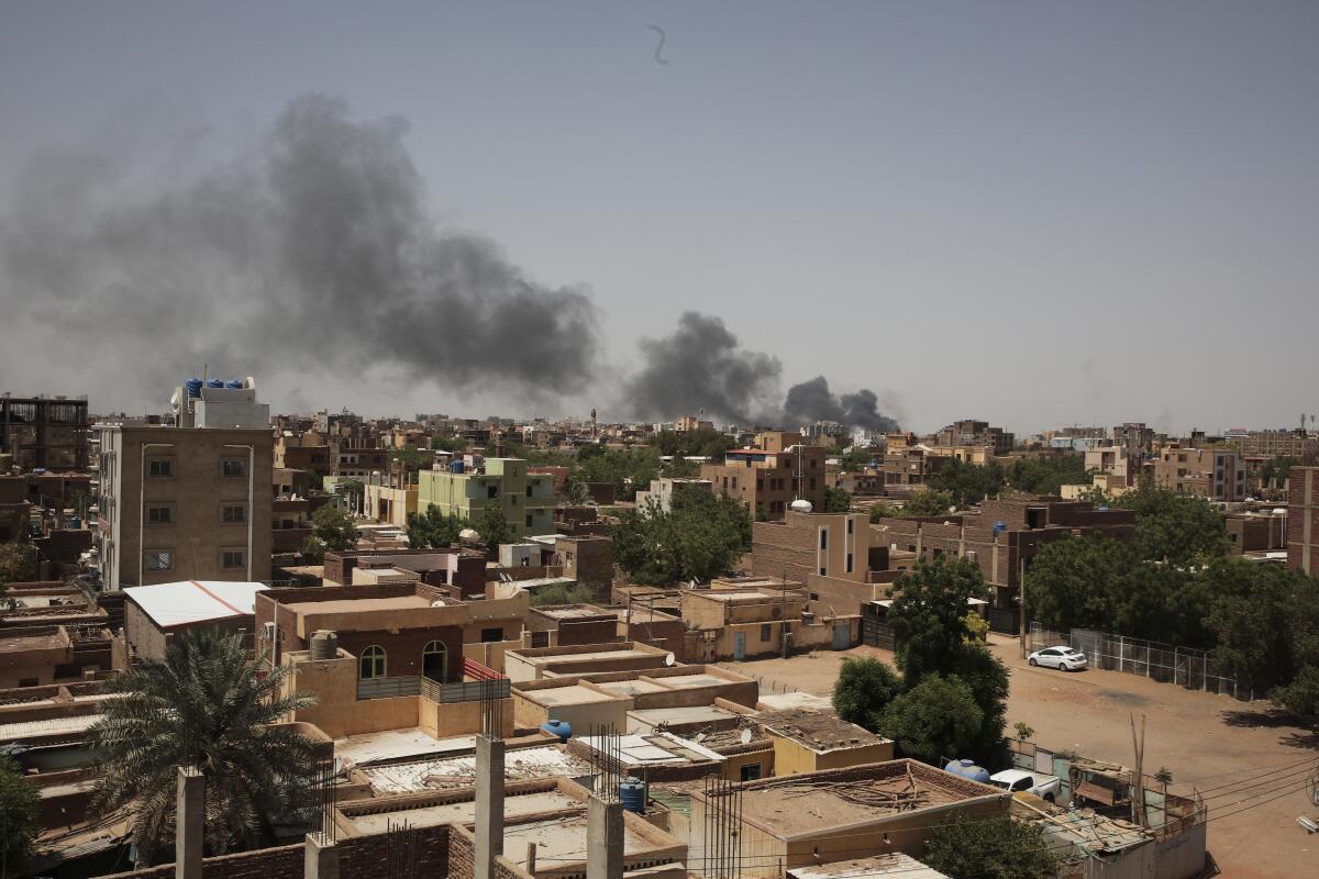 Smoke rises from fighting between the Sudanese Army and Rapid Support Forces in a view from the outskirts of Khartoum, Sudan