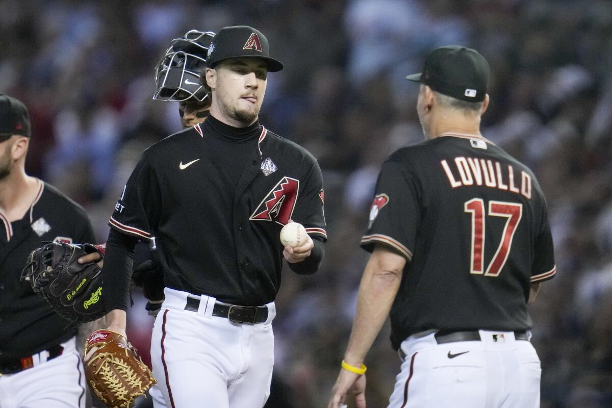 Arizona Diamondbacks relief pitcher Kyle Nelson is pulled from the game by manager Torey Lovullo.
