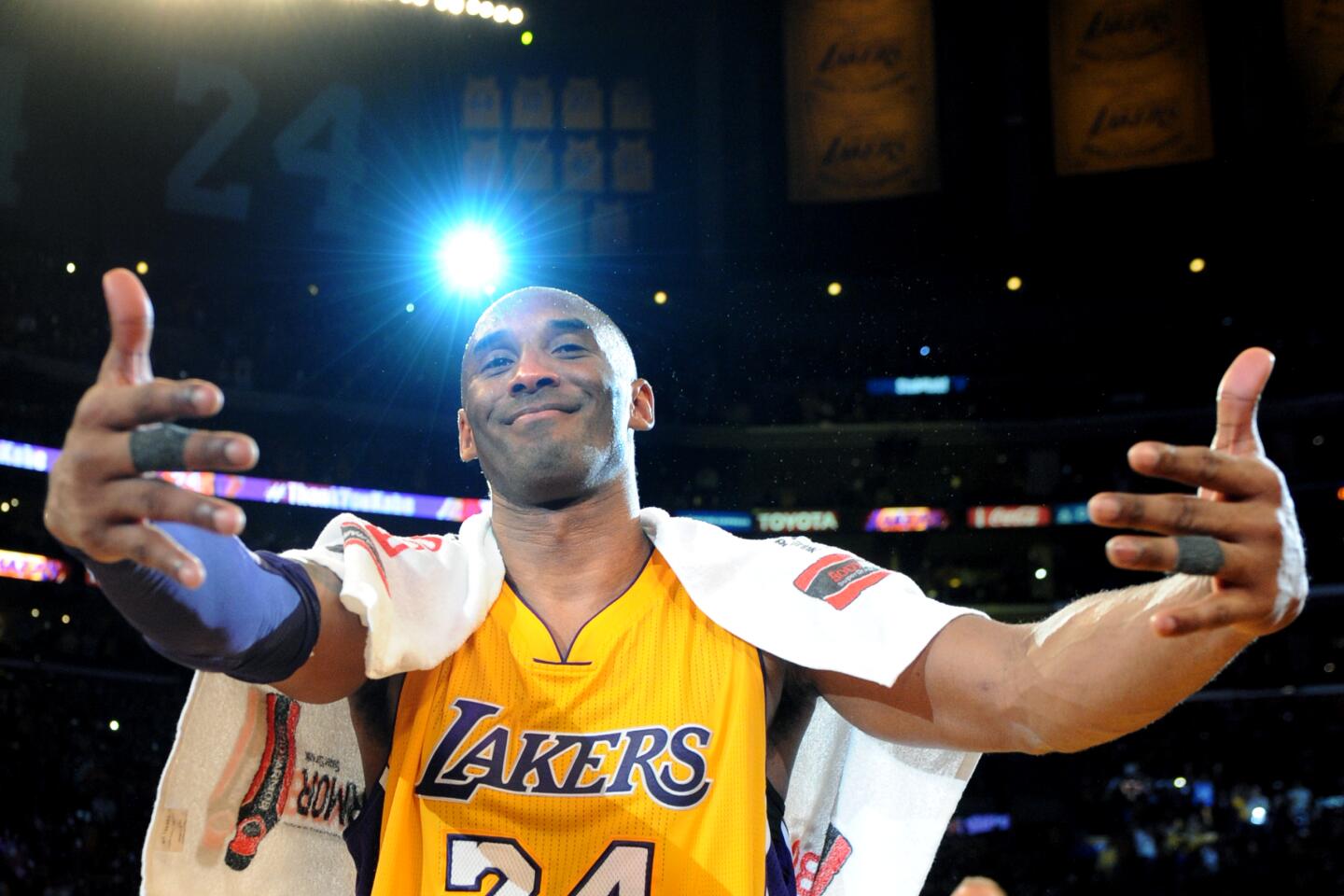 Kobe Bryant in street clothes talks to Chris Paul before the 2014 All Star  Game.JPG