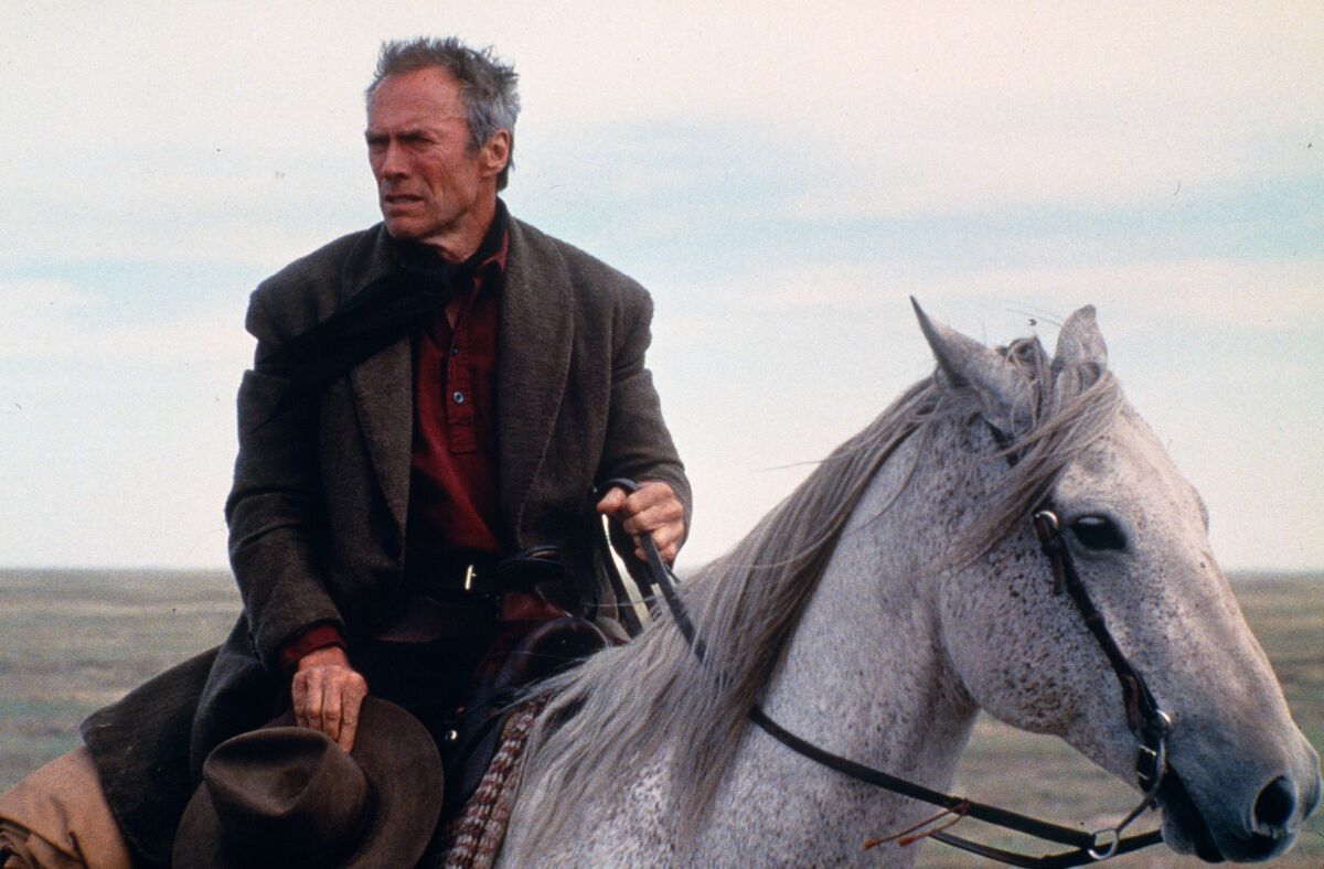 Clint Eastwood in horseback in the movie "Unforgiven" 