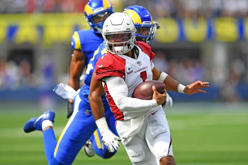 Inglewood, CA. October 3, 2021: Cardinals quarterback Kyler Murray scrambles for a first down against the Rams in the second quarter at SoFi Stadium Sunday. (Wally Skalij/Los Angeles Times)