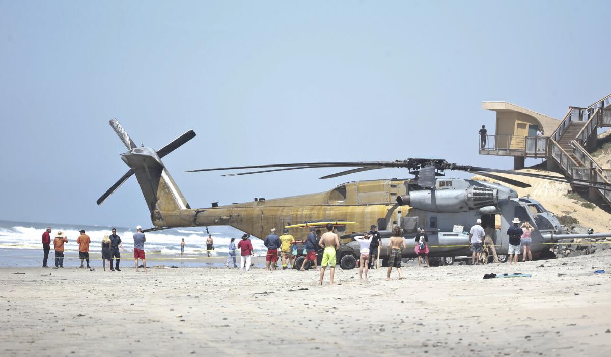 A Marine Corps helicopter sits in the sand where it made an emergency landing Wednesday in Solana Beach in northern San Diego County. the CH-53E Super Stallion was on a routine training mission.