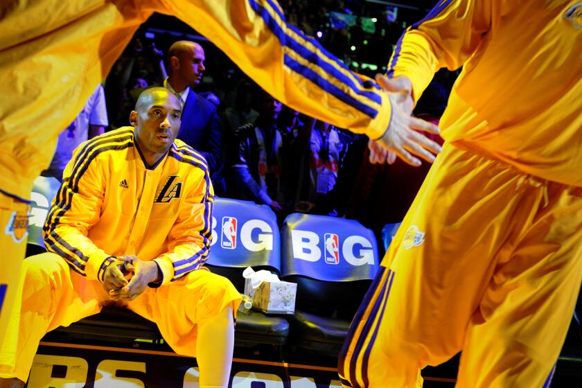 LOS ANGELES, CALIFORNIA JANUARY 11, 2013-Lakers Kobe Bryant waits to be introduced.