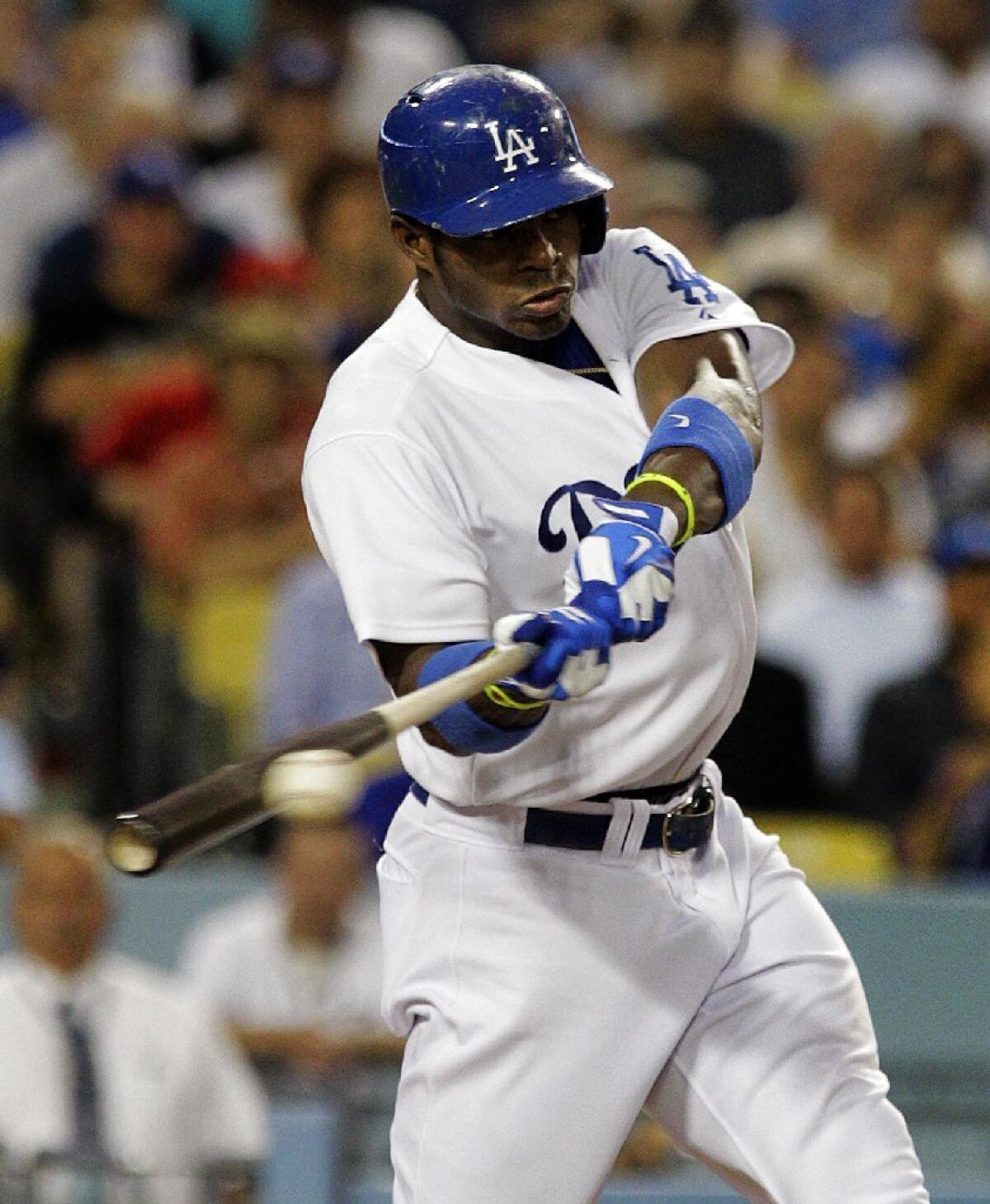 Dodgers outfielder Yasiel Puig connects. Major League Baseball has funded a study on how to make bats that break less frequently.
