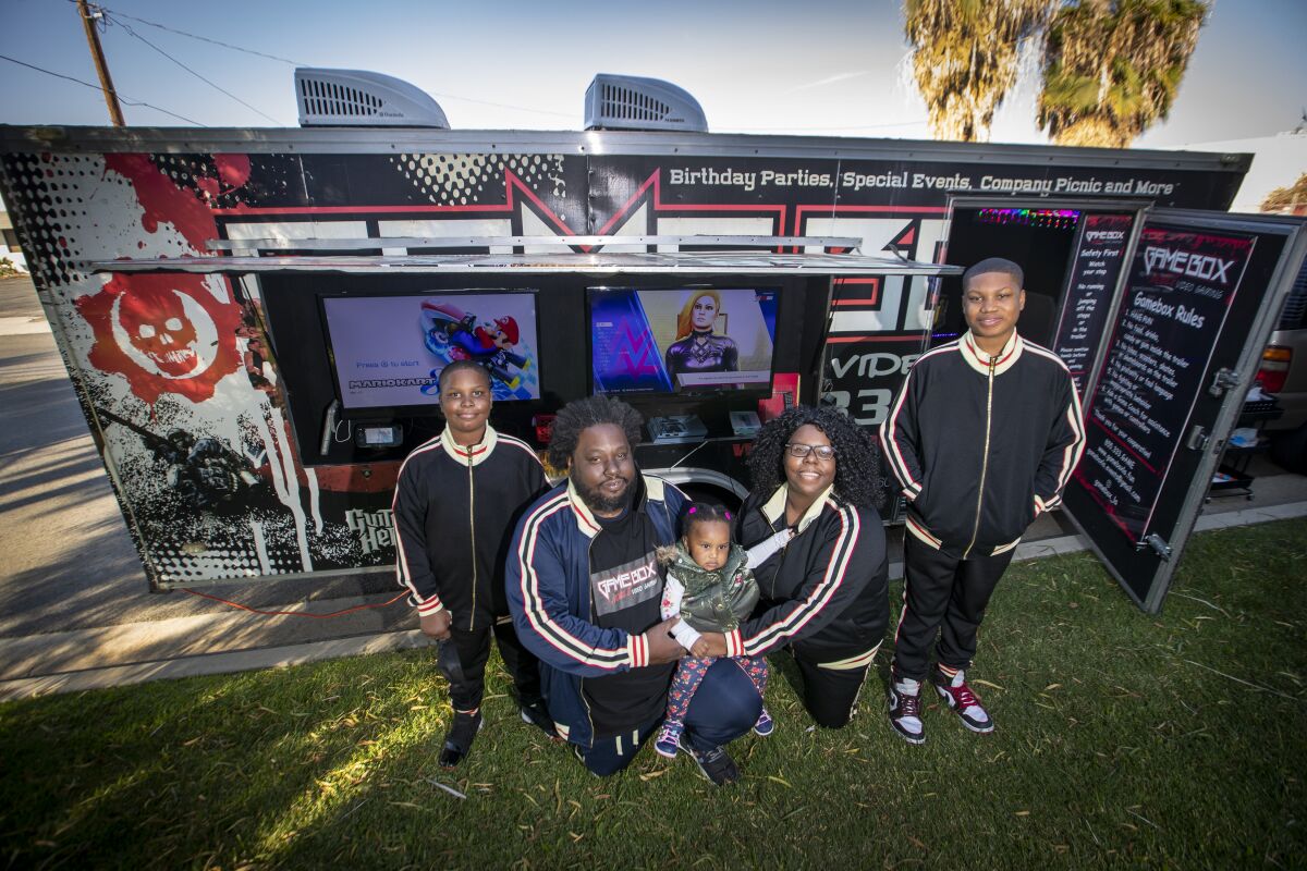 Ebony Lynk and Romel Mallard with their children: Bryce Hayes, Romari Mallard and Rori Mallard.