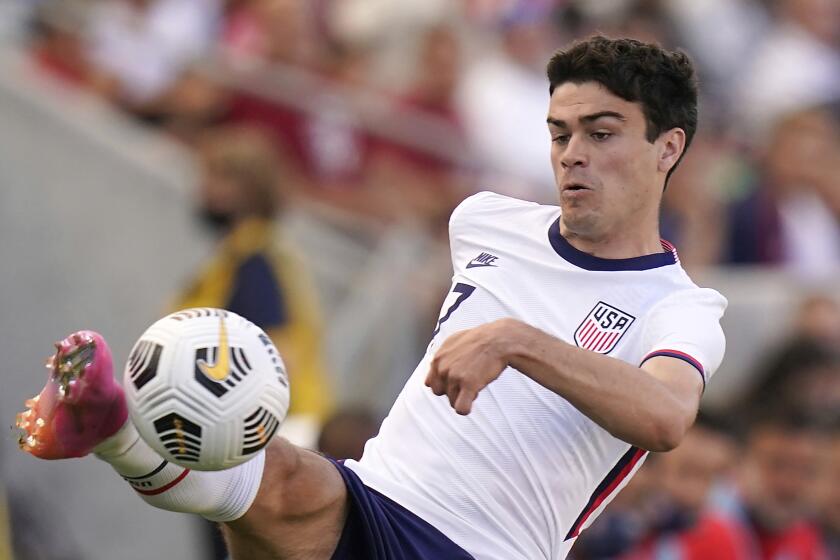 American Gio Reyna controls the ball during a 2021 match against Costa Rica 