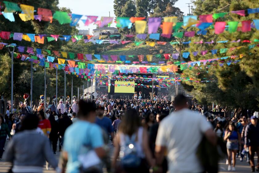 Thousands attended the first Besame Mucho Festival, at Dodger Stadium on Saturday, Dec. 3, 2022. More than 50 bands and singers performed on four stages spread out throughout the Dodger Stadium parking lots.