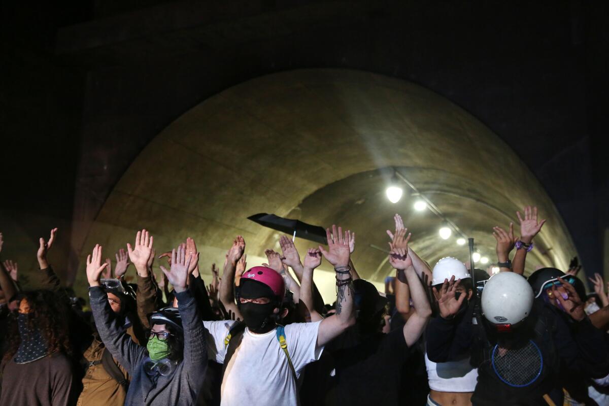 Protesters in the Third Street Tunnel on Wednesday in downtown Los Angeles after the shooting of Jacob Blake in Kenosha, Wis.