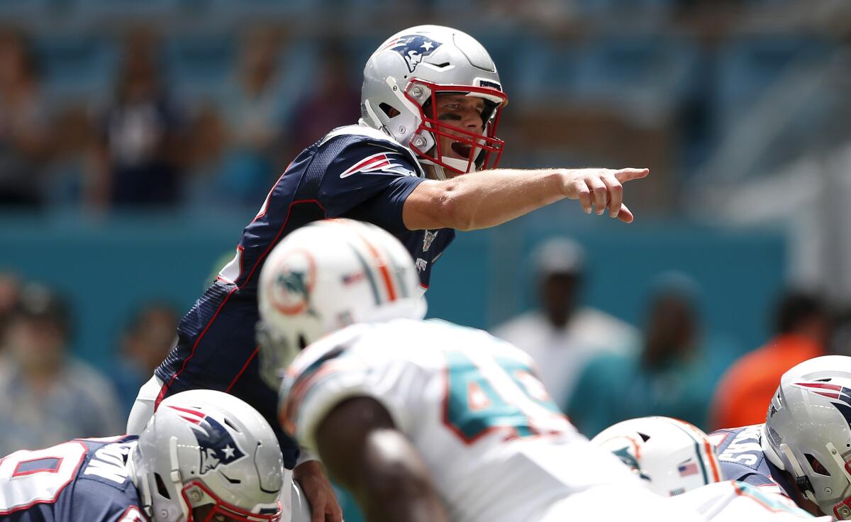 Patriots quarterback Tom Brady calls out a play against the Dolphins.