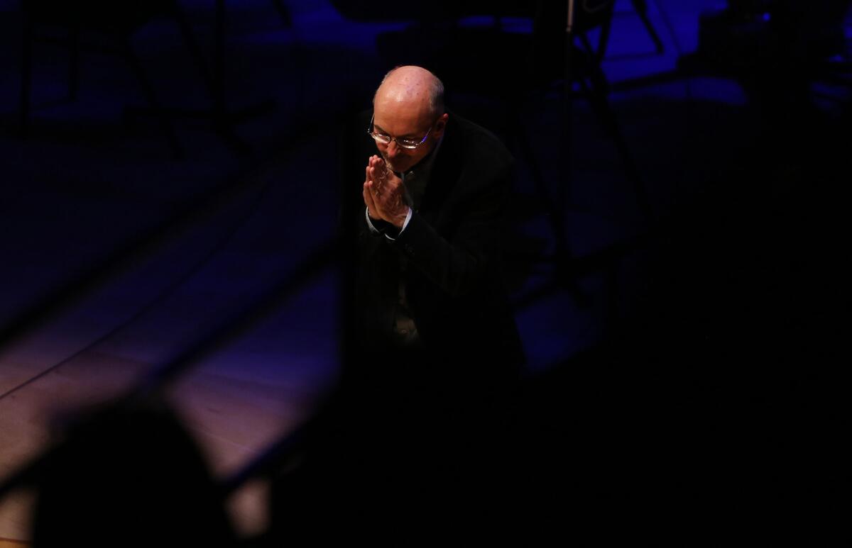 Bill Viola takes a bow after his video and sound installation "Inverted Birth" was shown at Walt Disney Concert Hall.