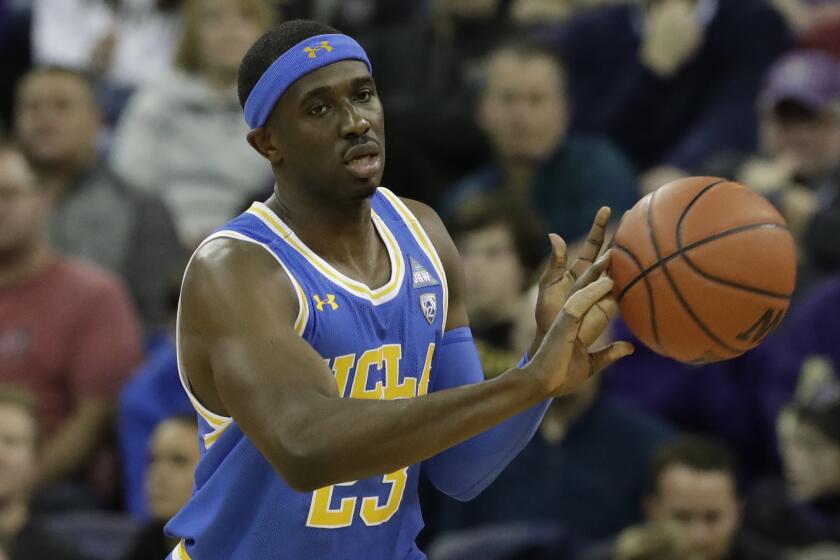 UCLA's Prince Ali in action against Washington in an NCAA college basketball game Thursday, Jan. 2, 2020, in Seattle. (AP Photo/Elaine Thompson)